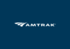 Amtrak offering promotional discount for Vietnam veterans headed to D.C. for upcoming commemorative events Amtrak white logo.